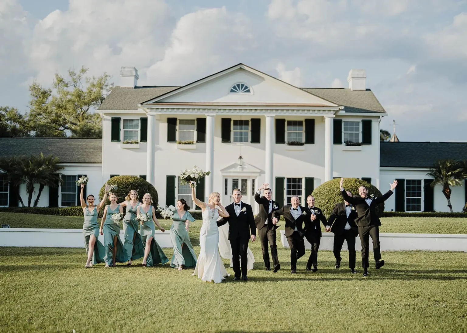Wedding party walking in front of Bellewood Plantation in Vero Beach