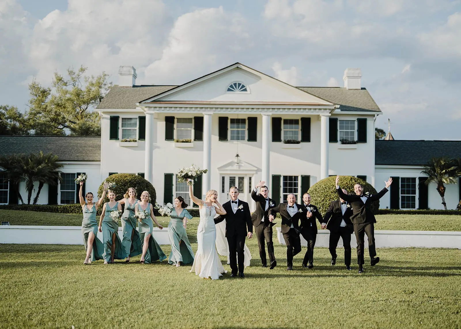 Wedding party walking in front of Bellewood in Vero Beach