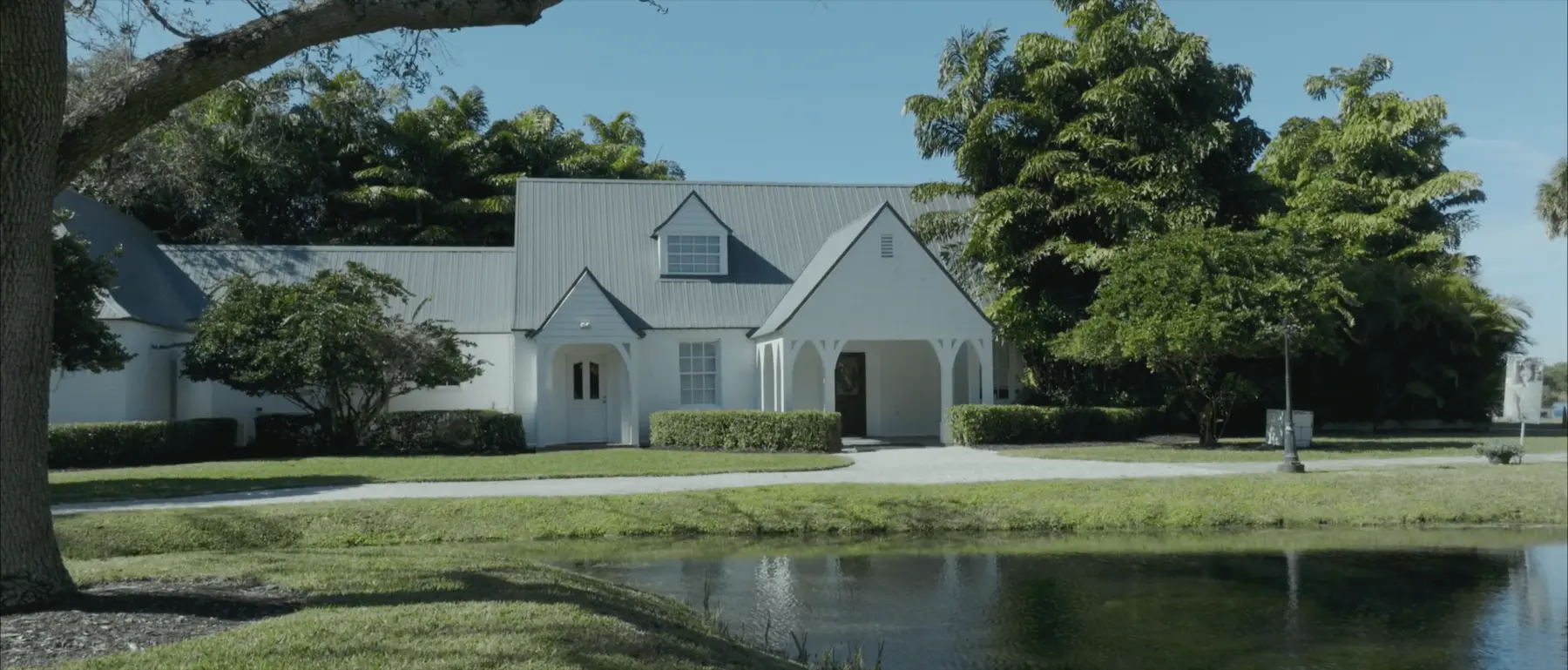 The Lake House wedding venue beside its pond in Fort Pierce